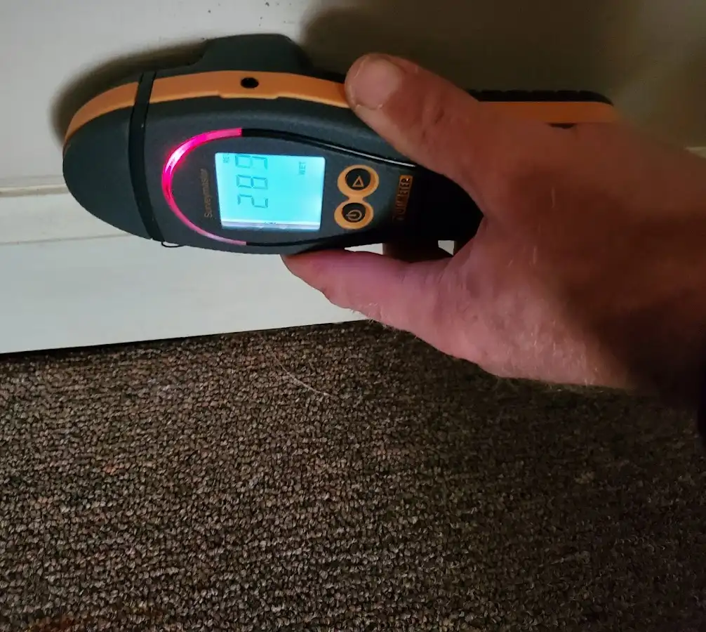 Moisture detection at baseboard during Sewage Cleanup & Sanitation in McPherson